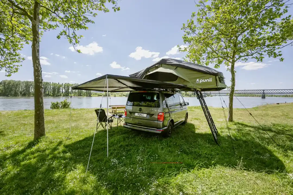 punii klappdachzelt markise baeume see wiese campingmoebel